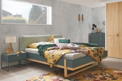 Amana von Hülsta - Bett grün mit Polsterkopfteil